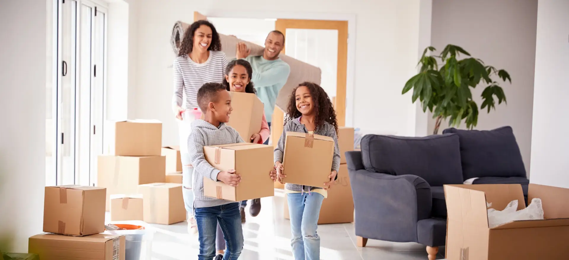 Happy family moving in to their new home thanks to Home South Mortgage